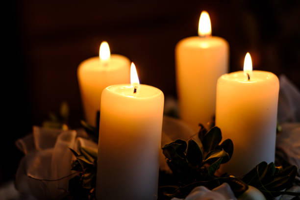 istock Beautiful four burning candles on advent wreath 899935136