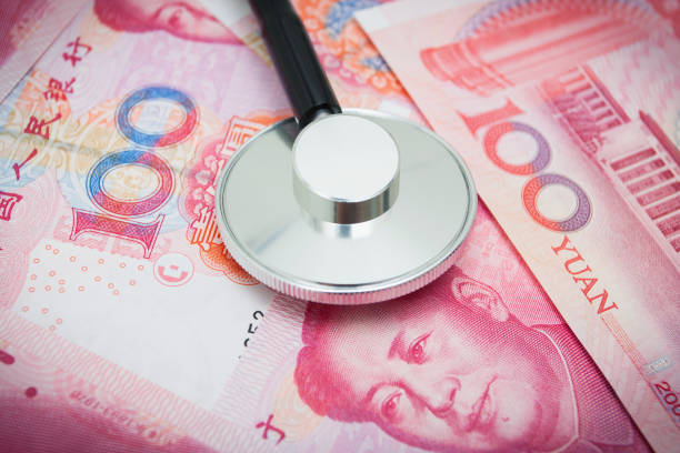 istock Stetroscope on Chinese Yuan Note Currency 899935402