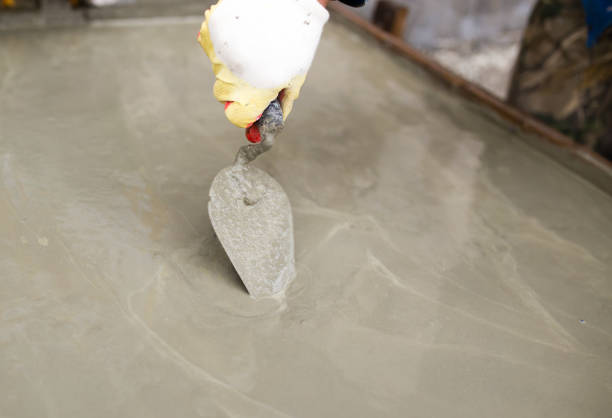 istock worker pours concrete mortar on a construction site 899938710