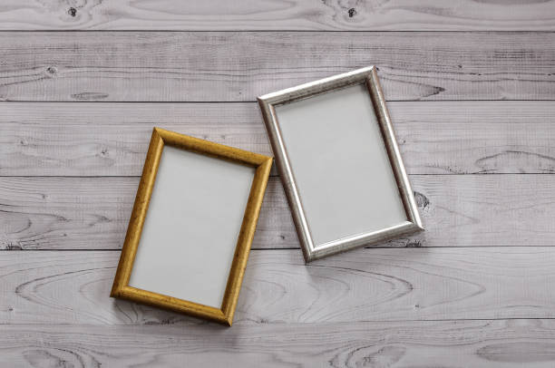 istock Two frames for photos on a light, vintage wooden background 899942760