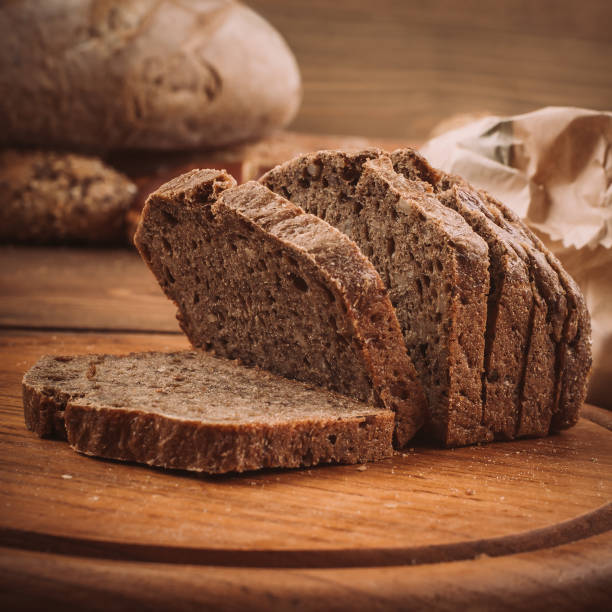 istock Various baked breads and rolls on rustic wooden table 899946652