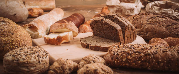 istock Various baked breads and rolls on rustic wooden table 899947030