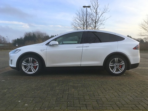 Lelystad, The Netherlands - December 29, 2017: White Tesla model X parked in a public parking lot in the city of Lelystad. Nobody in de vehicle.