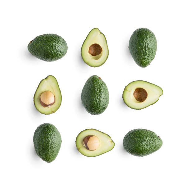 istock Seamless pattern with avocado and leaves on white background. Whole and half avocado with leaves.Food concept. With clipping path 899947746
