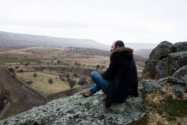 istock a man alone at the top 899950392