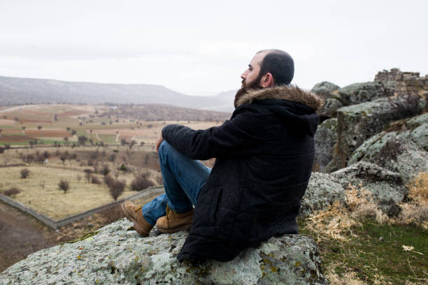 istock a man alone at the top 899950898