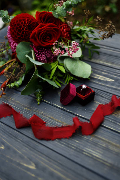 istock wedding offer with roses and wedding ring 899951076