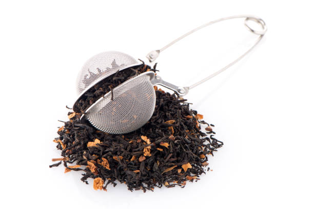 istock Black dry tea with petals 899951594
