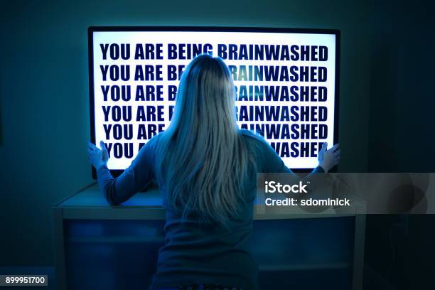 Woman Being Brainwashed By Television Stock Photo - Download Image Now - Television Set, Back Of Head, Cult