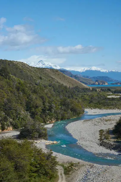 Rio los Maintenes flowing into the clear blue waters of Lago General Carrera in northern Patagonia, Chile