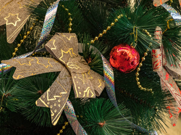 istock Shiny Christmas red ball hanging on pine branches 899955394