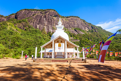 Japanese Peace Stupa or Peace Pagoda at the foot of Adams Peak. Adams Peak or Sri Pada is a tall and holy mountain in Sri Lanka.