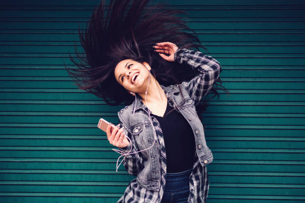 istock Happy girl dancing 899959838