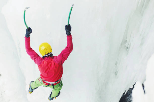 istock Ice climbing the North Caucasus, man climbing frozen waterfall. 899960608