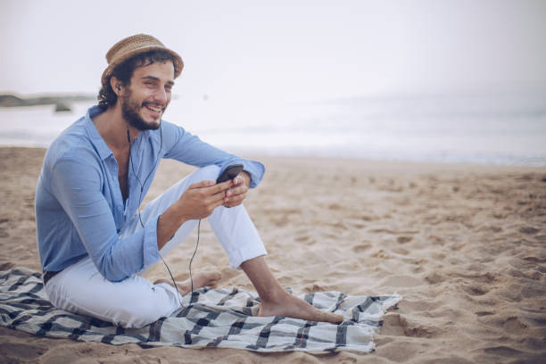 istock Enjoying music at coastline 899968776