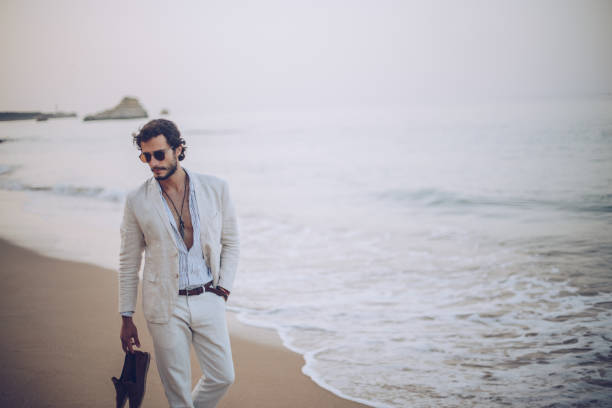 istock Enjoying a walk on the beach 899971818