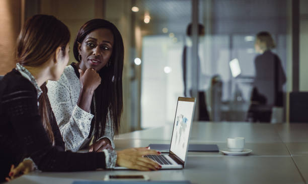 istock Business People Working Late in Office 899971956