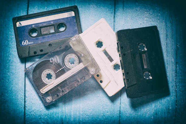istock Old cassette tapes with a wooden background 899972190