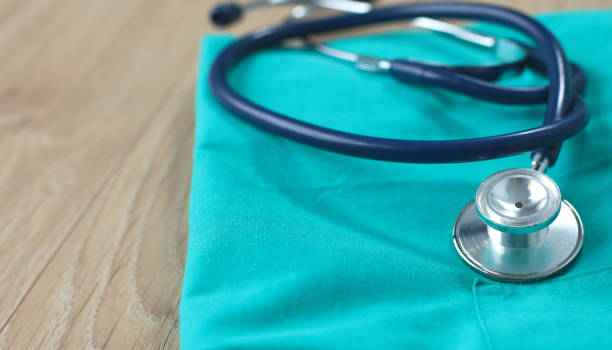 istock Stethoscope on a table with medical uniform 899973172