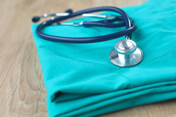 istock Stethoscope on a table with medical uniform 899973244