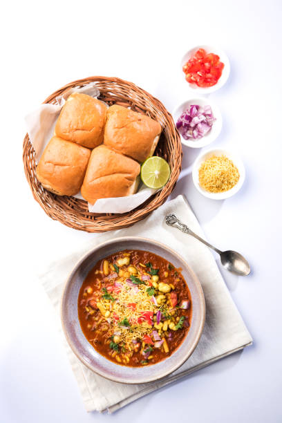 Misal Pav or misalpav, Misal Pav with Farsan. Traditional Indian spicy dish made with moth beans (match) and served with farina and bread Misal Pav or misalpav, Misal Pav with Farsan. Traditional Indian spicy dish made with moth beans (match) and served with farina and bread kolhapur stock pictures, royalty-free photos & images