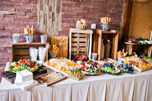 great variety of different multicolored snacks on the wedding buffet. - sandwich delicatessen bread cheese imagens e fotografias de stock