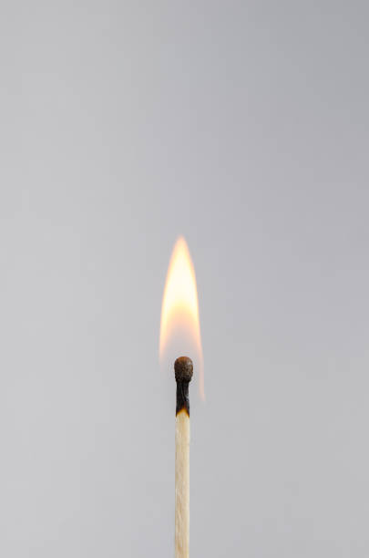 istock Photo of a burning match on a light background 899983878