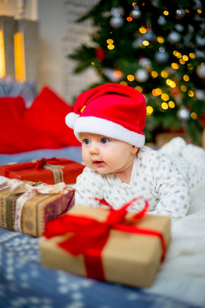 istock Baby in a christmas hat 899984346