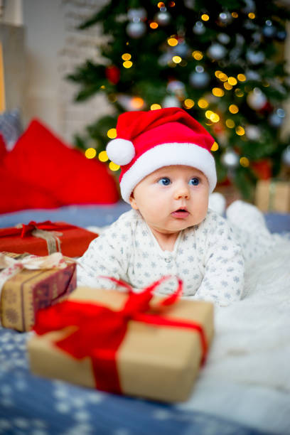 istock Baby in a christmas hat 899984430