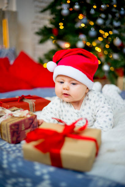 istock Baby in a christmas hat 899984512