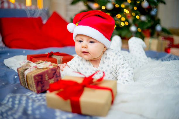 istock Baby in a christmas hat 899984620