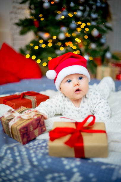 istock Baby in a christmas hat 899985040