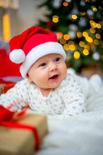 istock Baby in a christmas hat 899985410