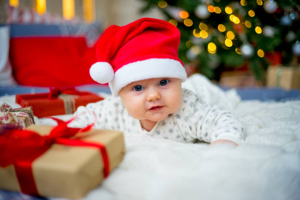 istock Baby in a christmas hat 899985658