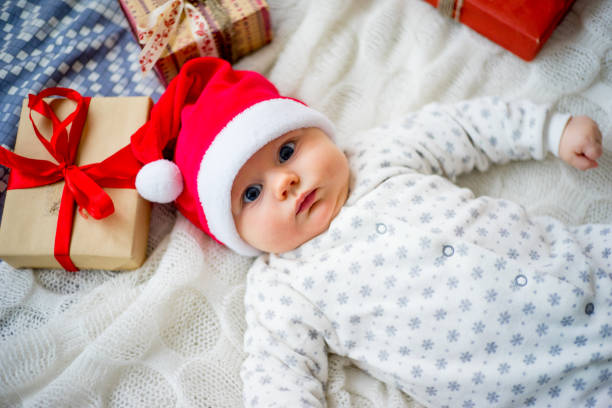 istock Baby in a christmas hat 899985944