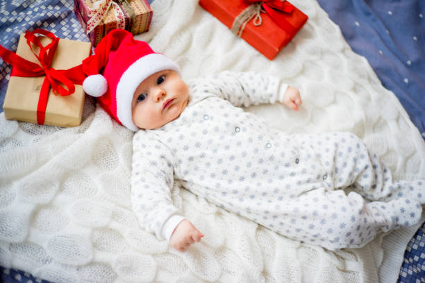 istock Baby in a christmas hat 899986026