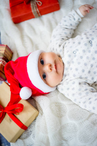 istock Baby in a christmas hat 899986254