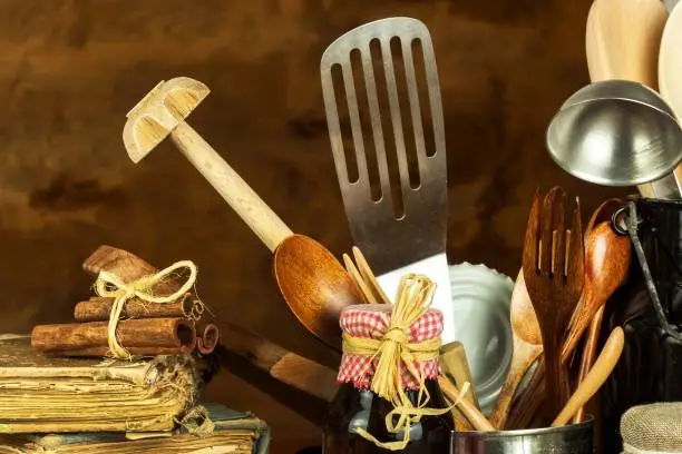 Kitchen tools on the table. Utensils for chefs. Old wooden spoon