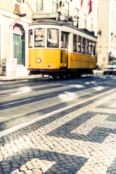 istock Typical Lisbon road with a yellow tram 899994484