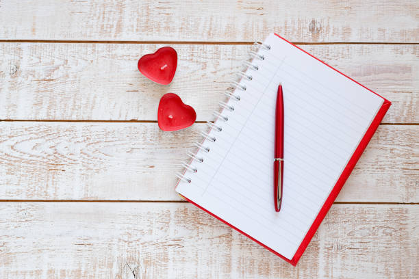 istock Valentines Day background with hearts over white wooden table 899994670