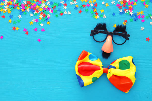 istock Carnival celebration concept with funny mustache glasses. Top view. 899999108