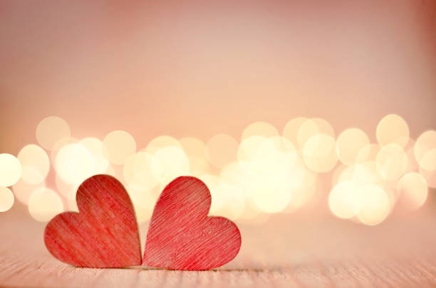 istock Hearts on a wooden table and background is a bokeh. 900003718