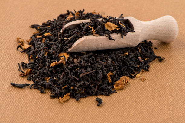 istock Black Dry Tea with a Wooden Spoon 900004722