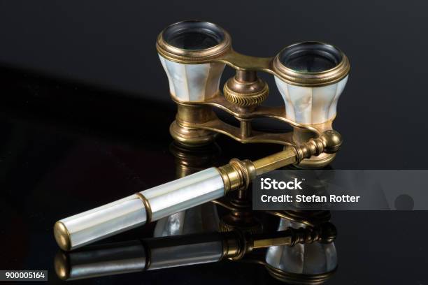 Closeup Of Old Antique Opera Glasses Lying On Black Piano Stock Photo - Download Image Now