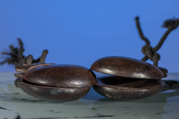 istock Two dark brown wooden spanish castanets 900005508