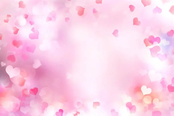 Photo of Valentine's day blurred hearts background.