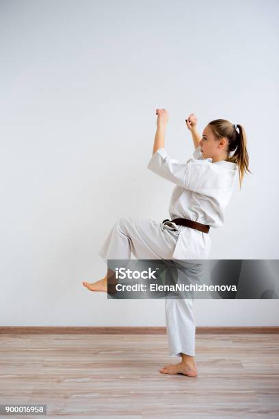 Karate Girl Training Stock Photo - Download Image Now - Kicking, One Woman Only, Women