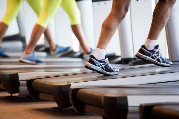 istock Two people are running on treadmill 900017394