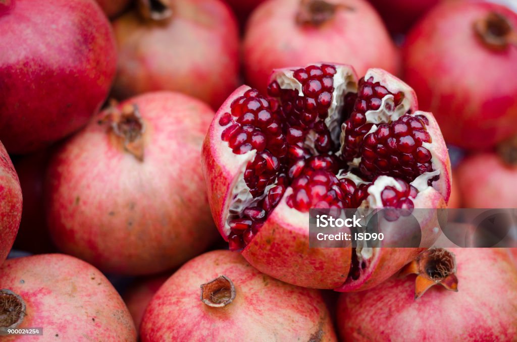 natural background of sweet fresh coral red pomegranate ripes, group of pomegranates. pomegranate closeup, background Pomegranate Stock Photo