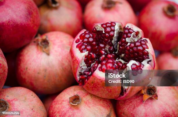 Natural Background Of Sweet Fresh Coral Red Pomegranate Ripes Group Of Pomegranates Pomegranate Closeup Background Stock Photo - Download Image Now